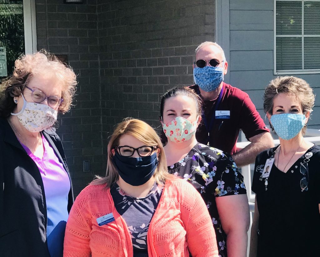 Chaplaincy Hospice House staff wearing hand-sewn masks donated by the community